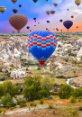 Hot Air Balloons Landing In A Cappadocia Goreme Top of Mountain Park Turkey.