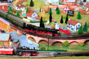 Modelo ferroviário em miniatura com trens