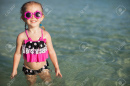 19978369-adorable-little-girl-on-tropical-beach-vacation