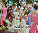 Casal Cortando um Bolo de Casamento